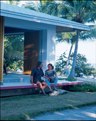 
Beth and Ron relax on the steps of their oceanfront home.

